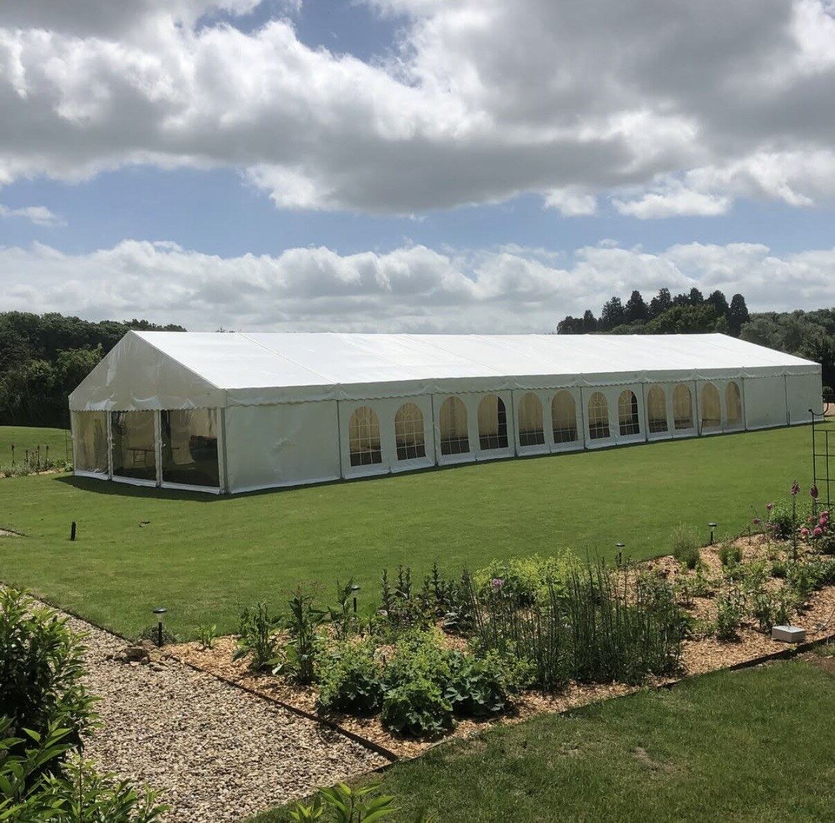 Large outdoor event marquee on lawn